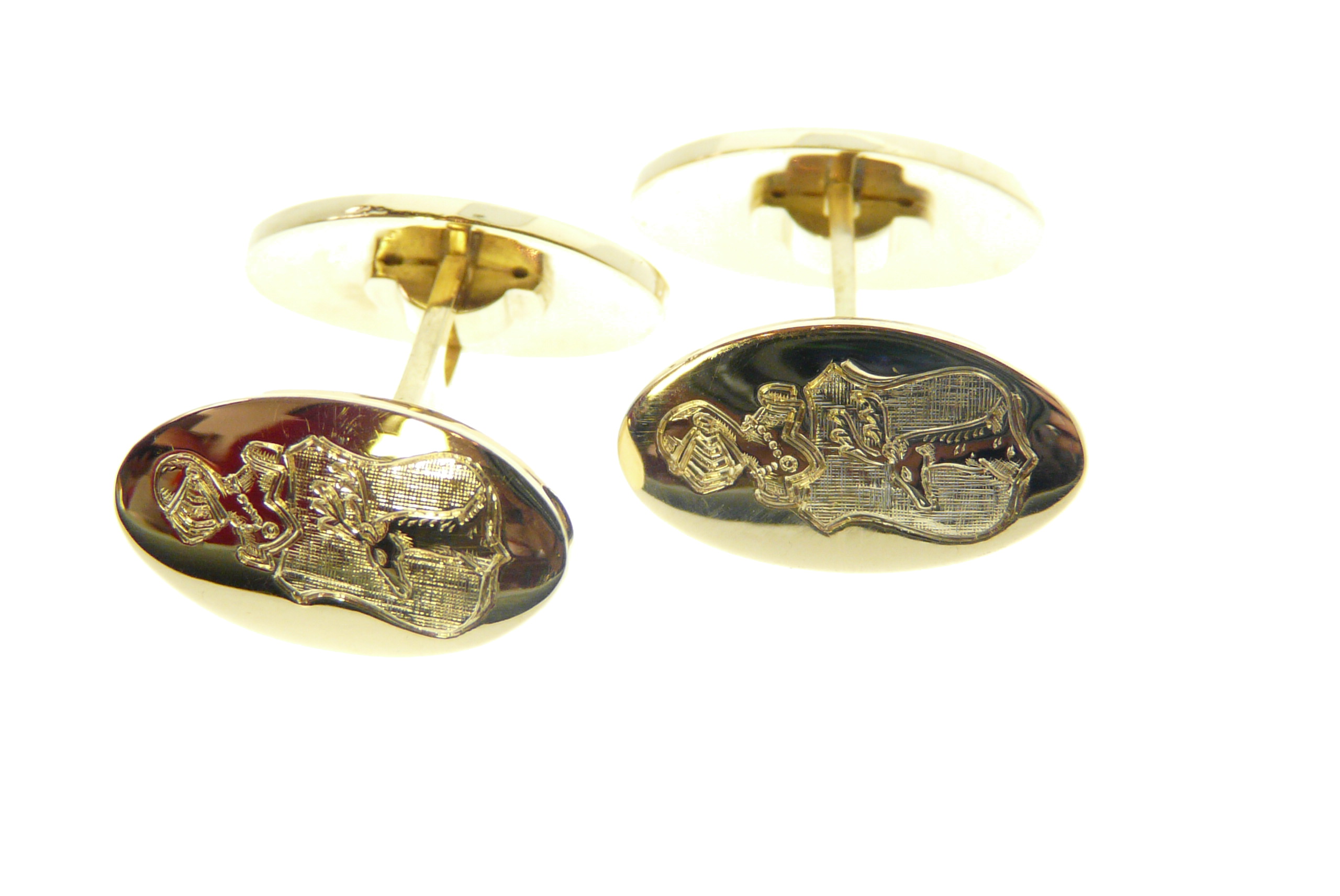 Gold cuff links with engraved coat of arms